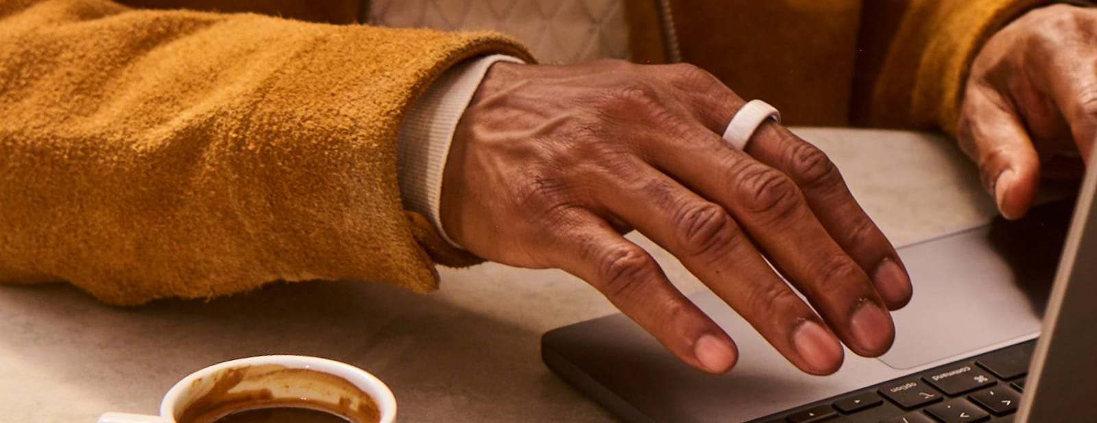 A hand wearing an Oura Ring, from Oura’s newsroom