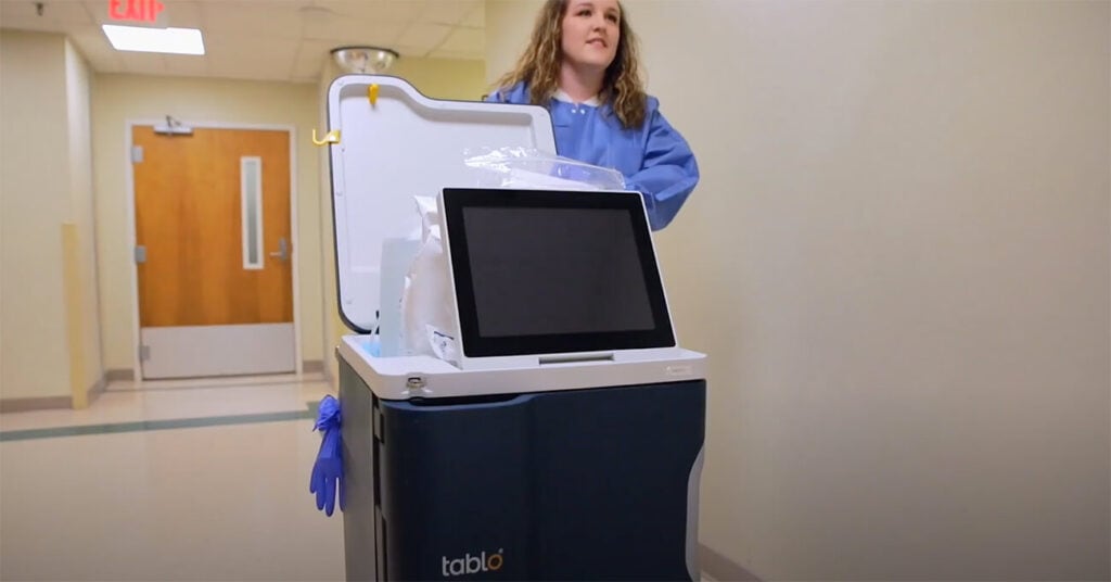 The Tablo Hemodialysis System beside a clinician, from Outset Medical’s product page